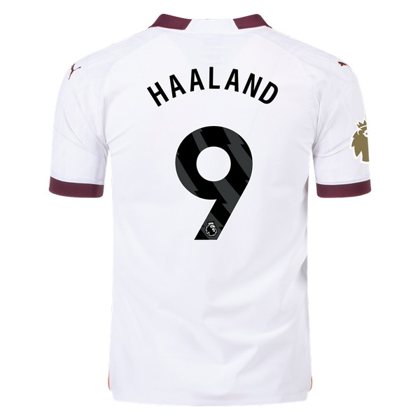 Manchester City 2023-2024 away white and aubergine jersey, back view